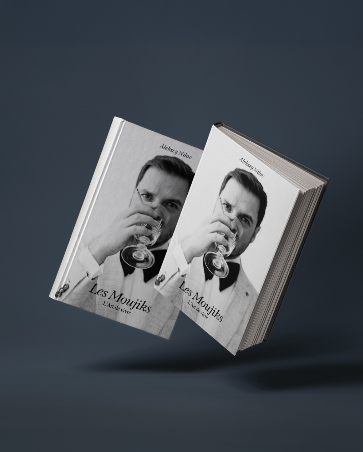 Two copies of Les Moujiks against a deep slate background.